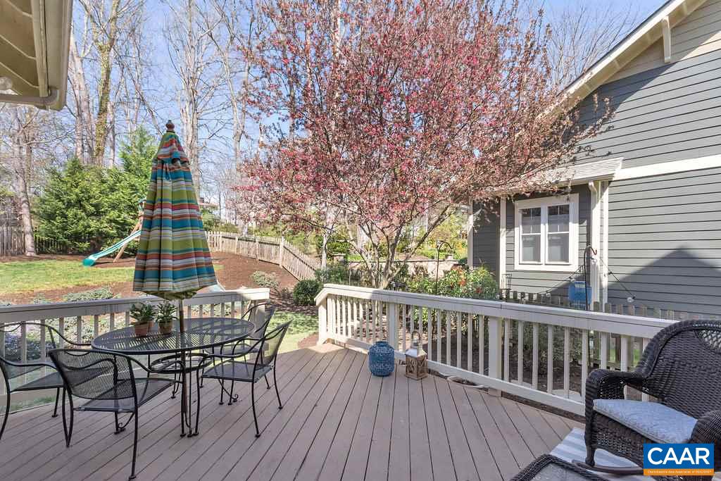 825 Village Road Charlottesville, VA 22903 - Photo 33 of 42 a view of a roof deck with table and chairs and wooden floor