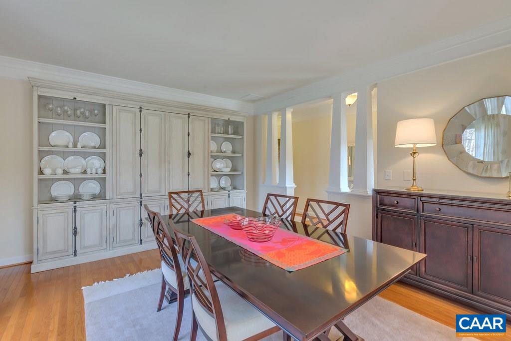 825 Village Road Charlottesville, VA 22903 - Photo 5 of 42 a dining room with a wooden table and chairs