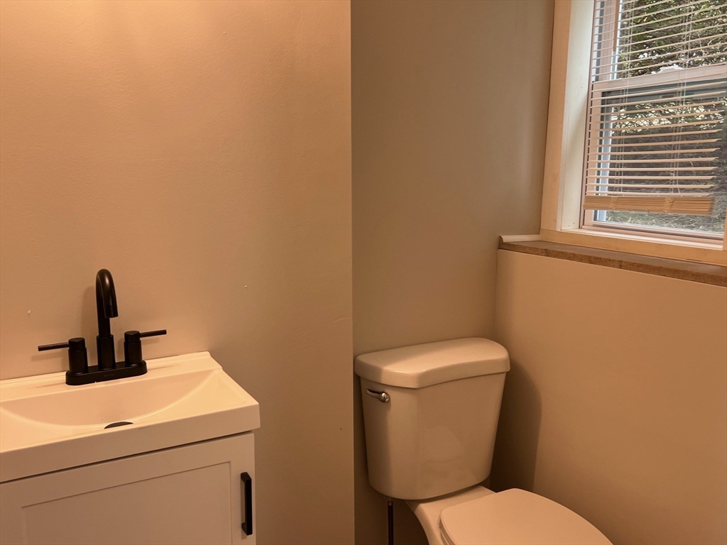 22 Eisenhower Road Swansea, MA 02777 - Photo 12 of 17 a bathroom with a toilet and a sink