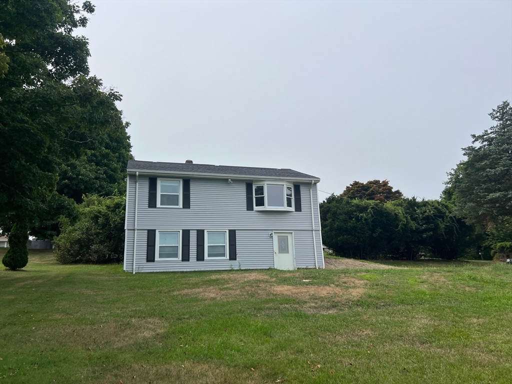 22 Eisenhower Road Swansea, MA 02777 - Photo 16 of 17 a front view of a house with a garden