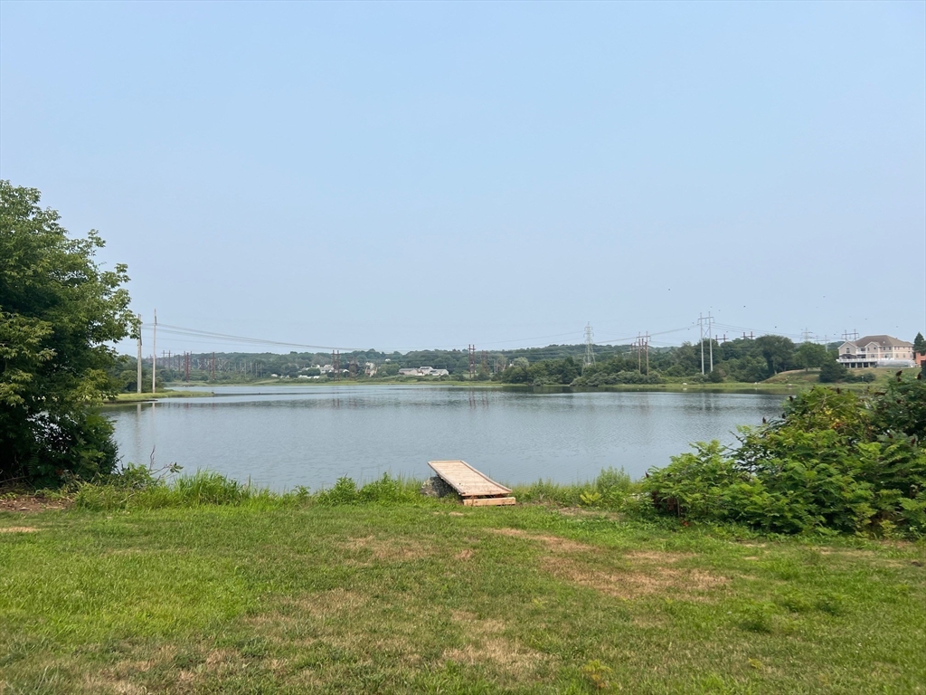 22 Eisenhower Road Swansea, MA 02777 - Photo 4 of 17 a view of a lake from a yard