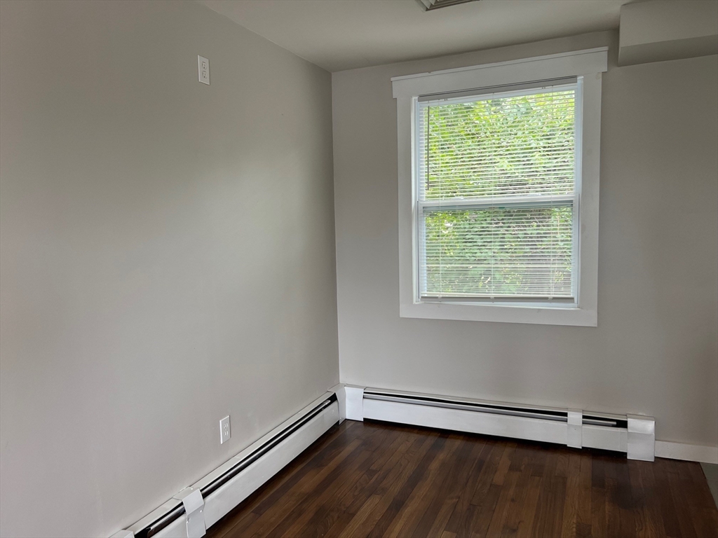 22 Eisenhower Road Swansea, MA 02777 - Photo 8 of 17 a view of a room with wooden floor and a window