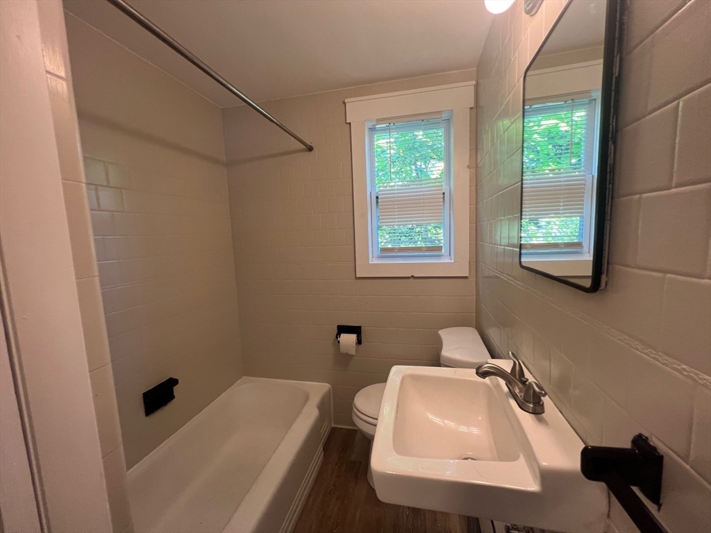 22 Eisenhower Road Swansea, MA 02777 - Photo 9 of 17 a bathroom with a sink toilet and tub