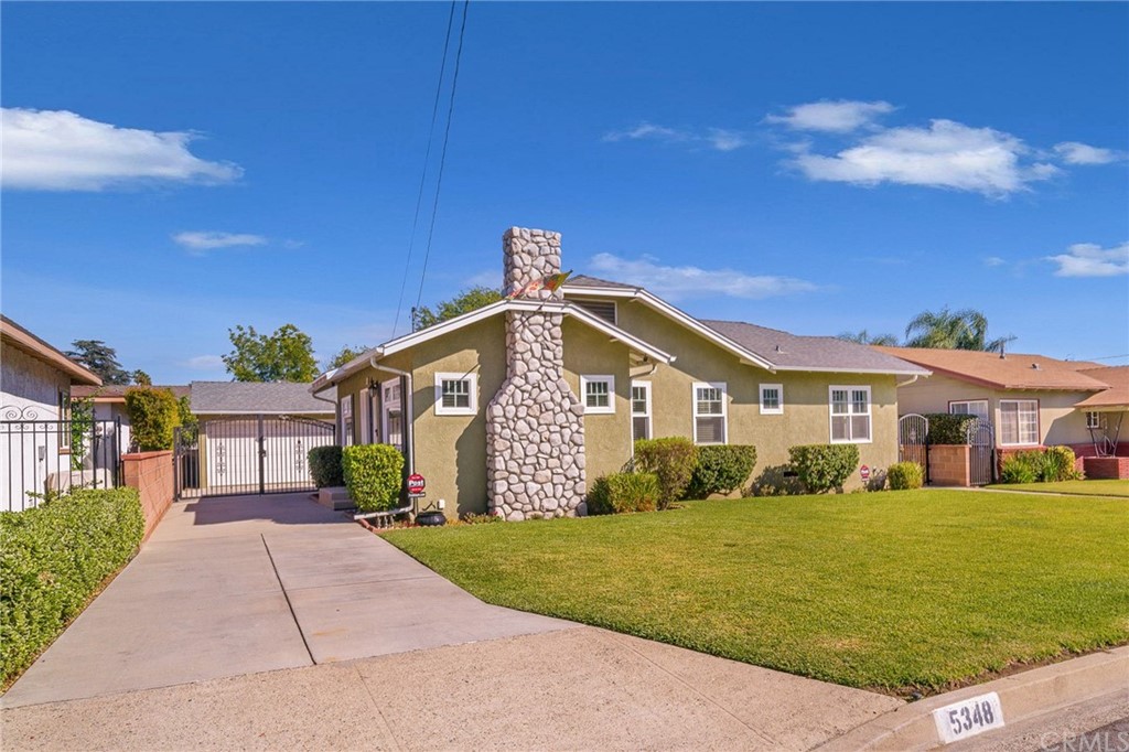 5348 Buttons Avenue Temple City, CA 91780 - Photo 1 of 1 a front view of a house with a garden