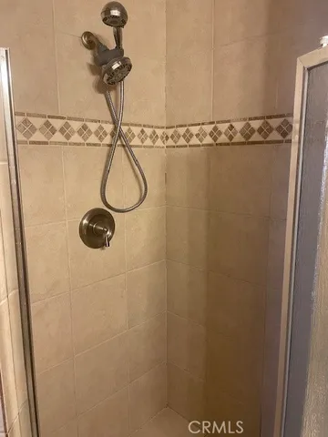 a backyard of a house with barbeque oven table and chairs