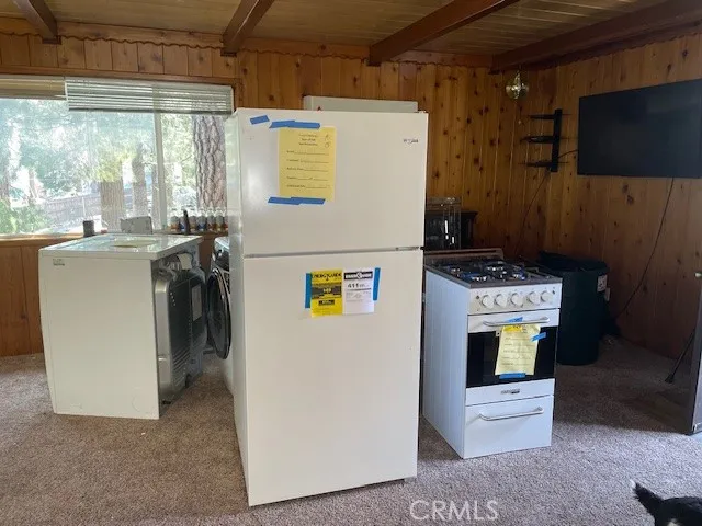 a view of a house with a wooden deck