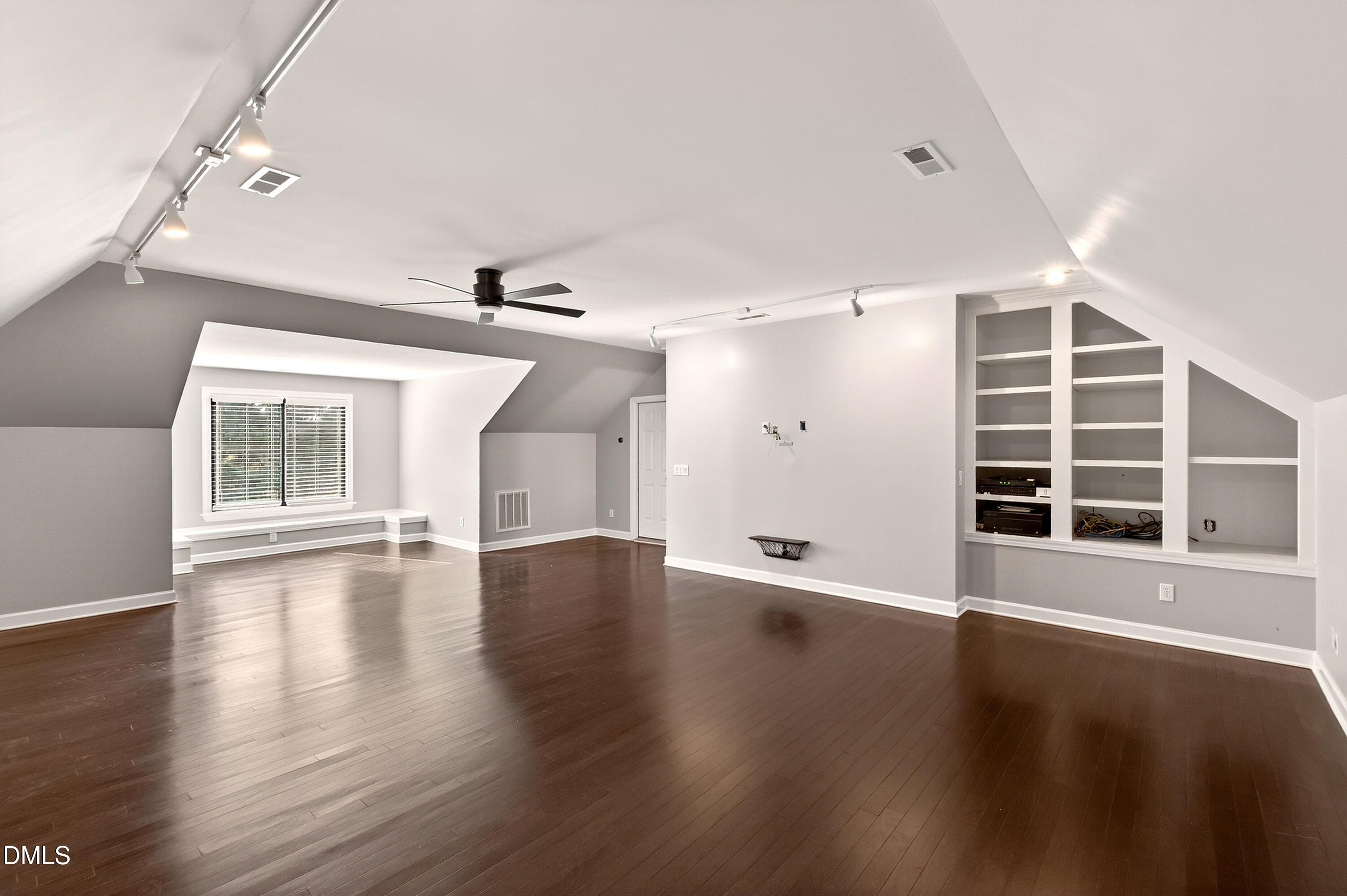 12408 Cilcain Court Raleigh, NC 27614 - Photo 56 of 80 an empty room with wooden floor and windows