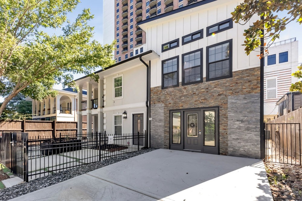 6325 Riverview Way, Unit ABCD Houston, TX 77057 - Photo 12 of 33 a view of a white building among the street