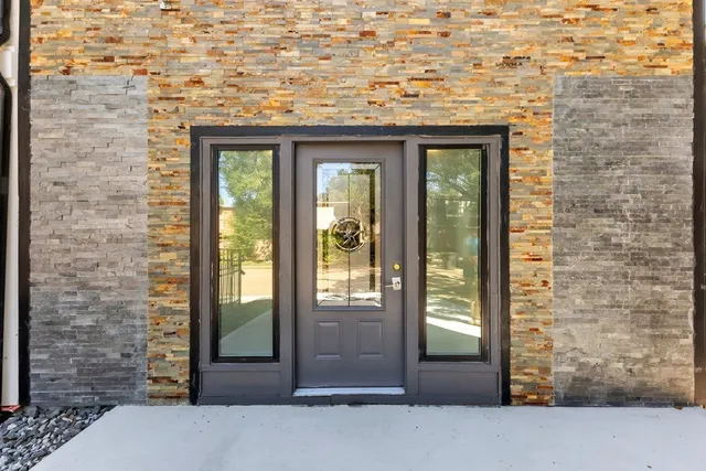 a front view of a building with a glass door