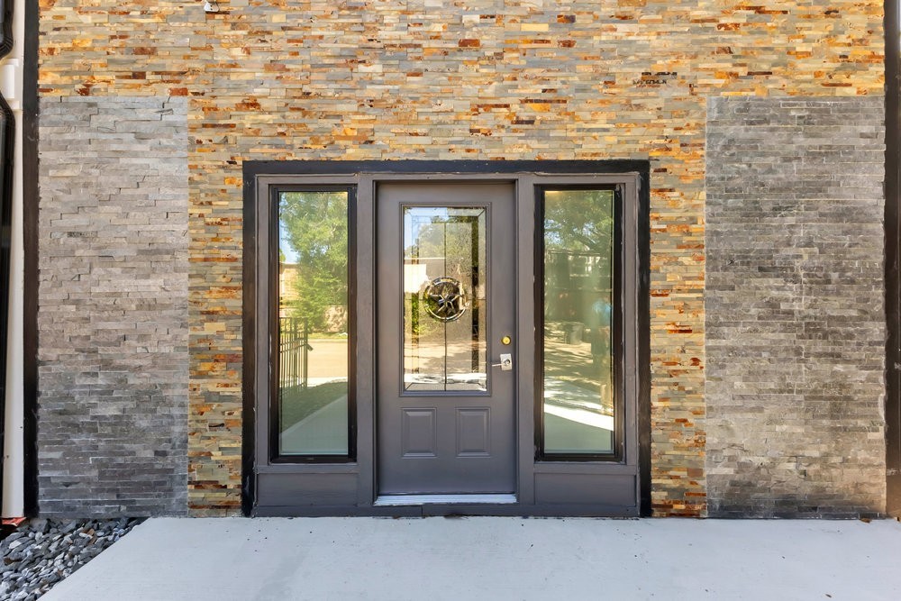 6325 Riverview Way, Unit ABCD Houston, TX 77057 - Photo 13 of 33 a front view of a building with a glass door