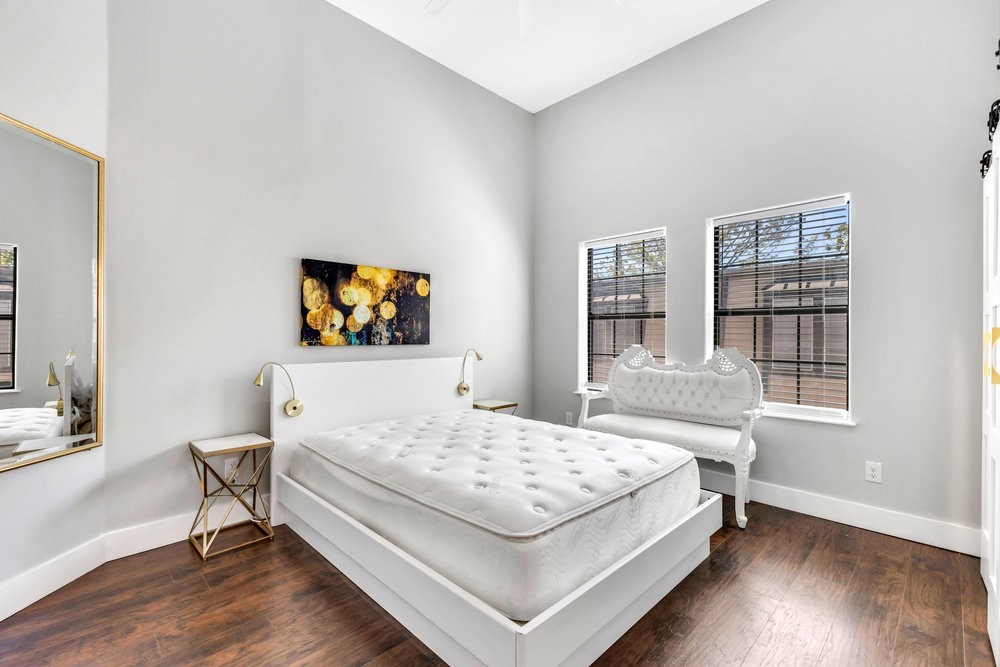 6325 Riverview Way, Unit ABCD Houston, TX 77057 - Photo 23 of 33 a living room with a bed and a window