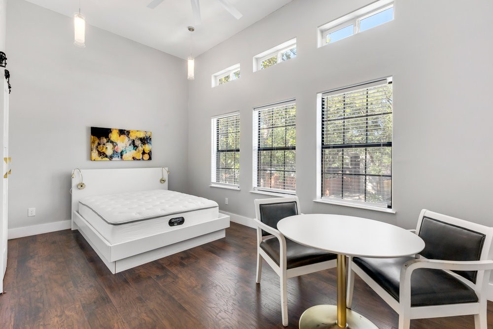 6325 Riverview Way, Unit ABCD Houston, TX 77057 - Photo 25 of 33 a living room with furniture a table and a large window