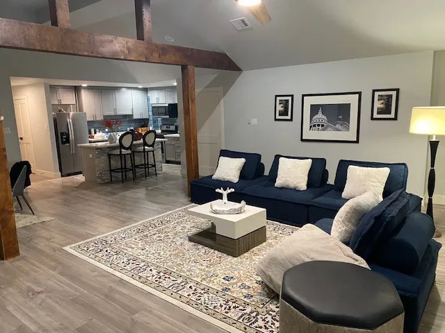 a living room with furniture and a rug