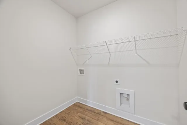 a bathroom with a granite countertop toilet sink and mirror