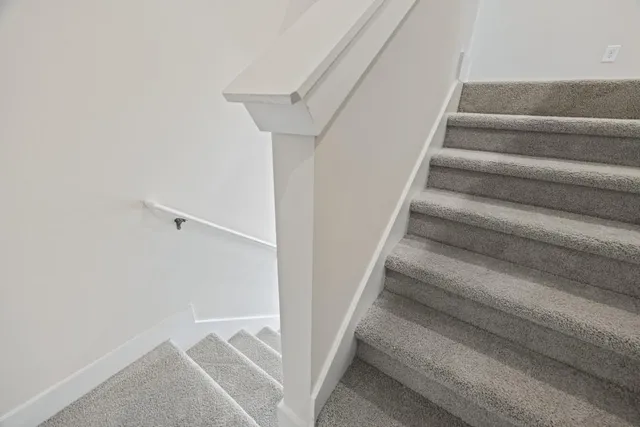a bathroom with a sink toilet vanity and shower