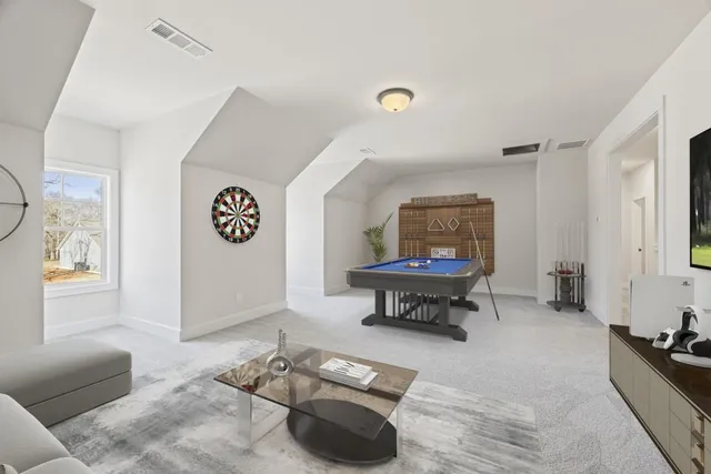 a bathroom with a granite countertop sink a toilet and shower