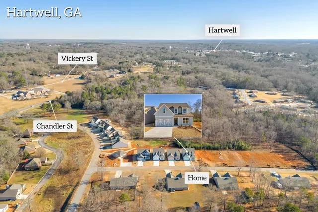 a view of a hallway with wooden floor and closet