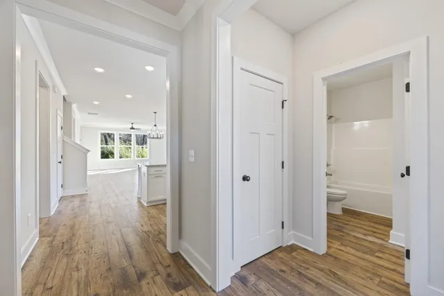 a large kitchen with granite countertop a stove top oven a sink a counter space and cabinets