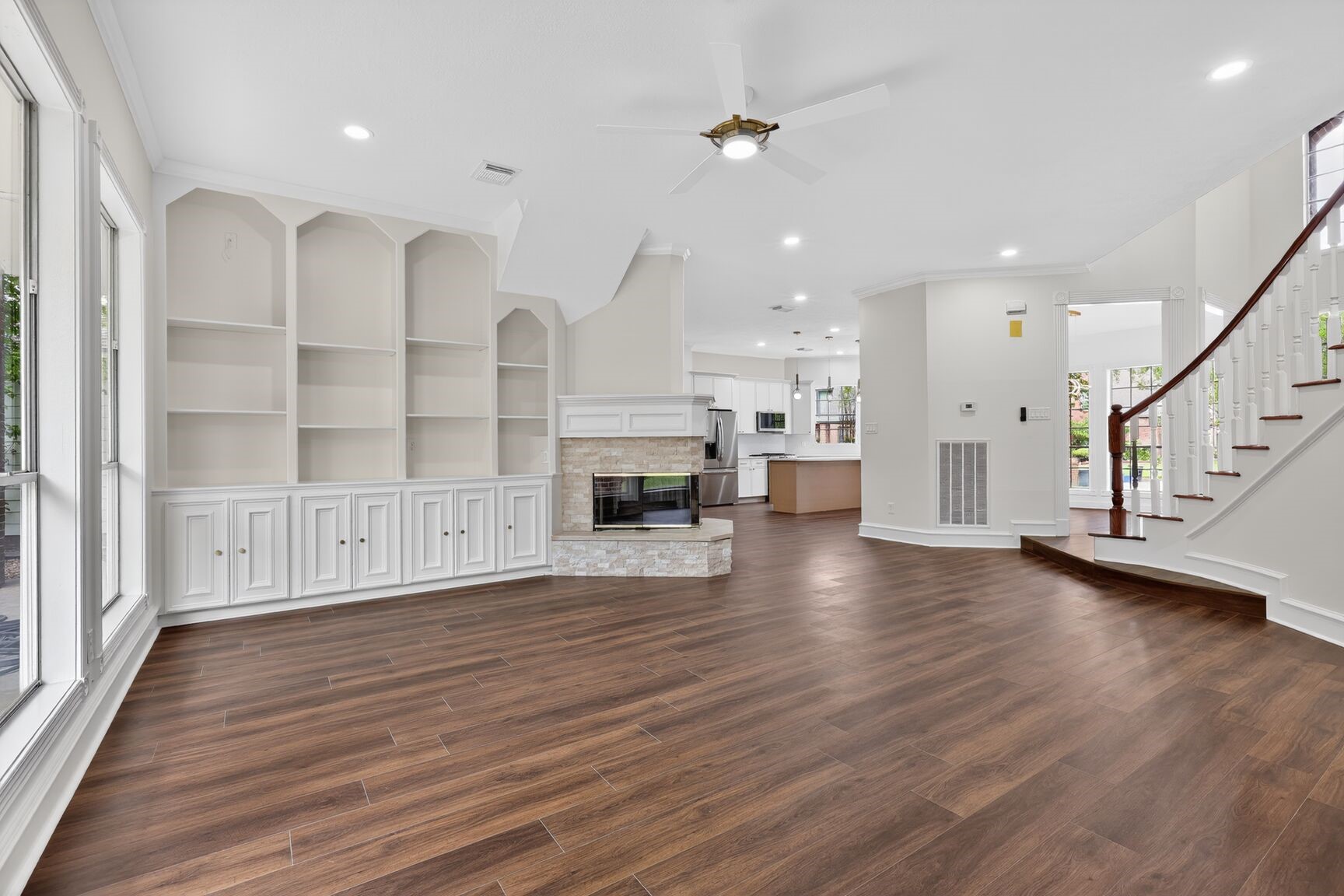 17519 Shelburne Lane Spring, TX 77379 - Photo 11 of 31 a view of a livingroom with wooden floor and staircase