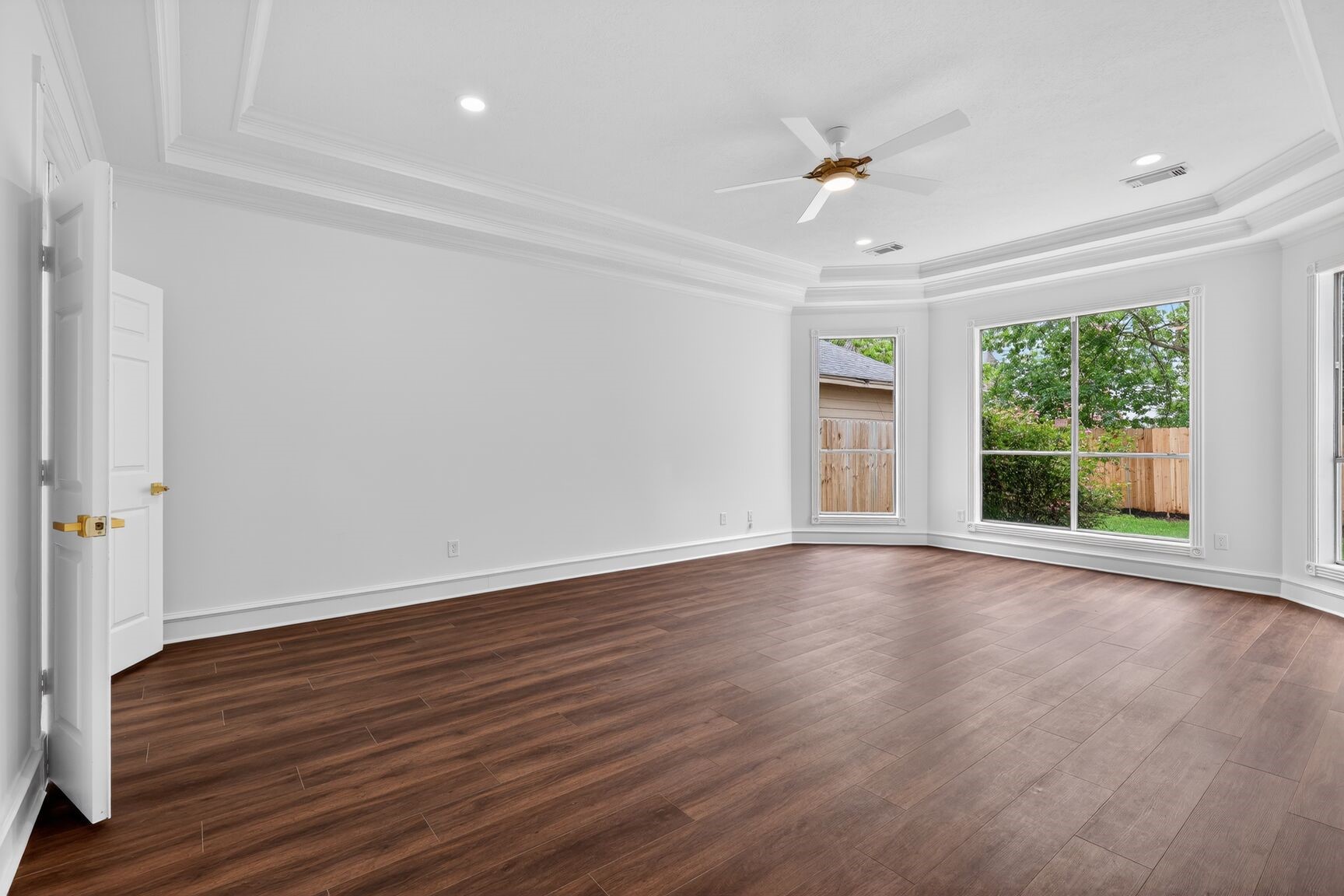 17519 Shelburne Lane Spring, TX 77379 - Photo 13 of 31 a view of an empty room with wooden floor and a window
