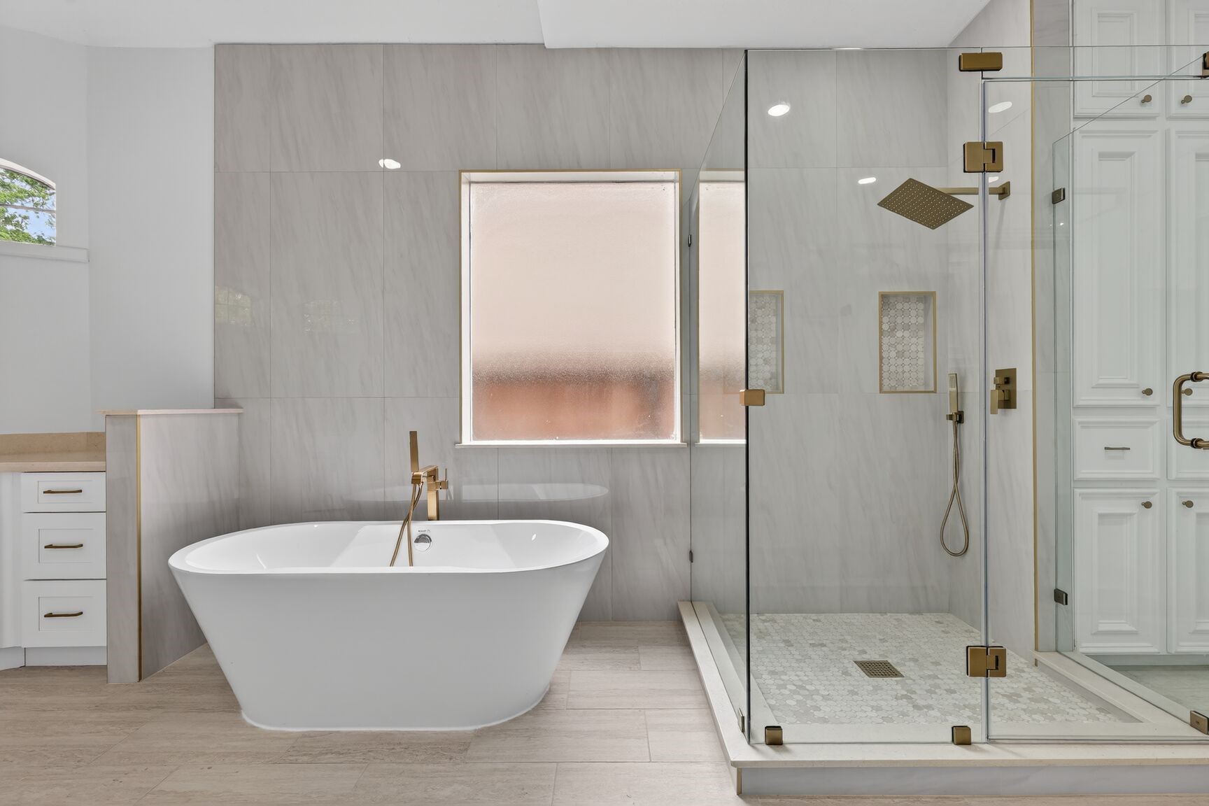17519 Shelburne Lane Spring, TX 77379 - Photo 16 of 31 a bathroom with a bathtub and shower
