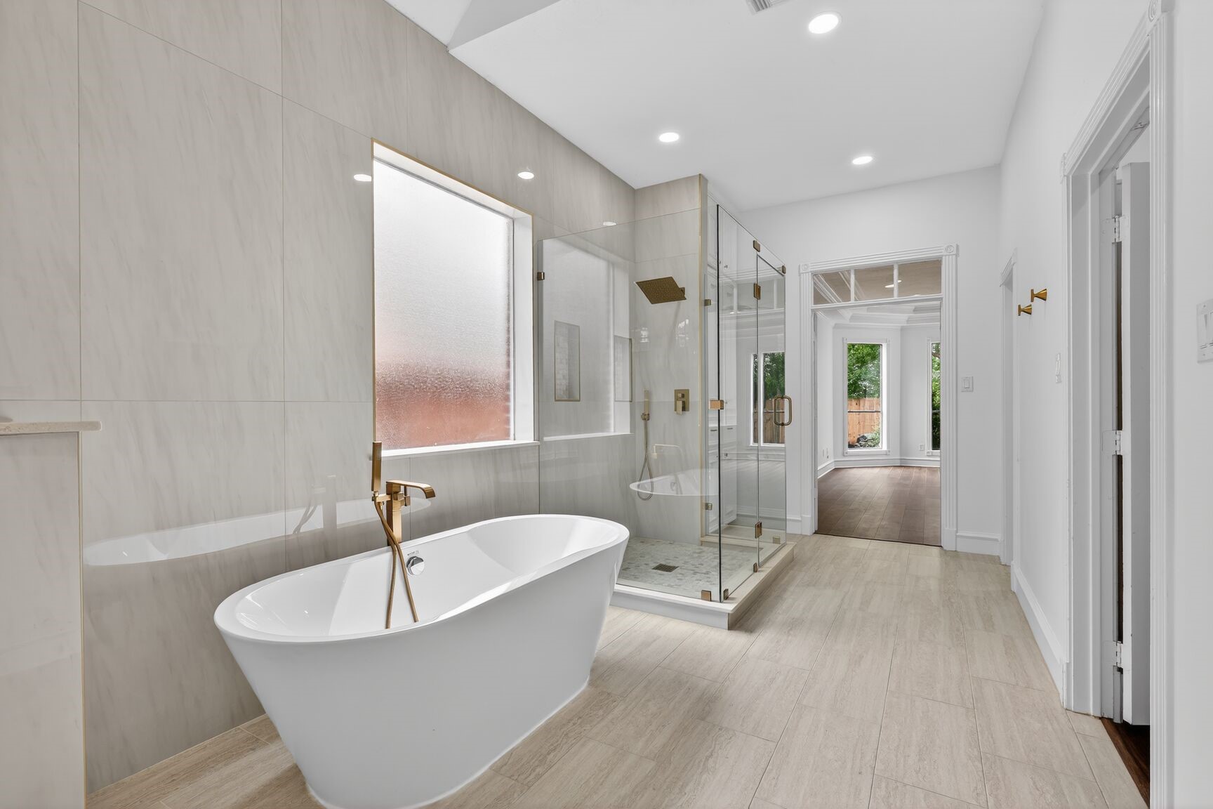 17519 Shelburne Lane Spring, TX 77379 - Photo 18 of 31 a spacious bathroom with a bathtub and a shower