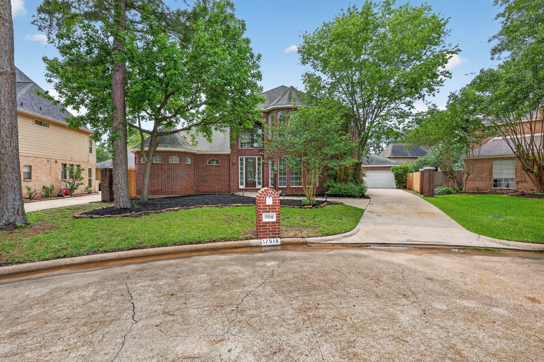 17519 Shelburne Lane Spring, TX 77379 - Photo 2 of 31 a view of a house with a big yard and large trees