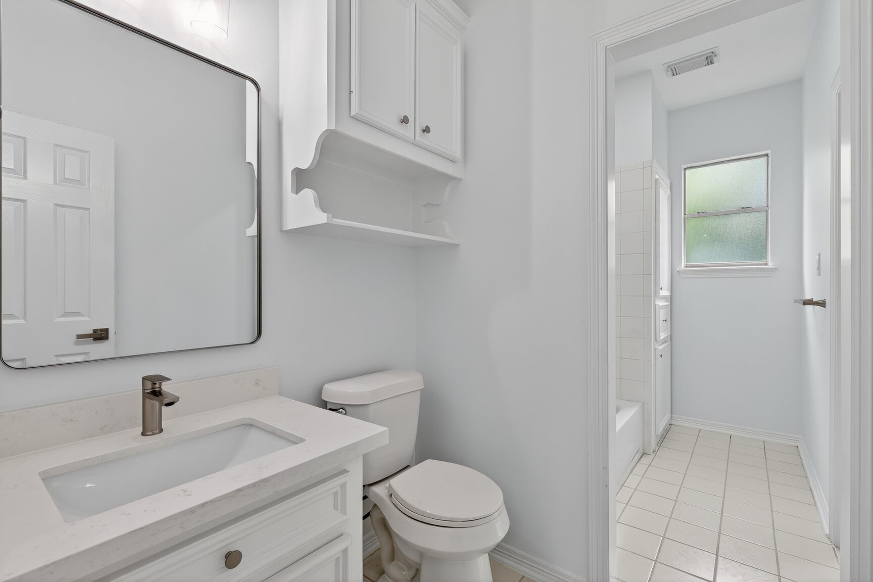 17519 Shelburne Lane Spring, TX 77379 - Photo 21 of 31 a bathroom with a sink a toilet and a mirror