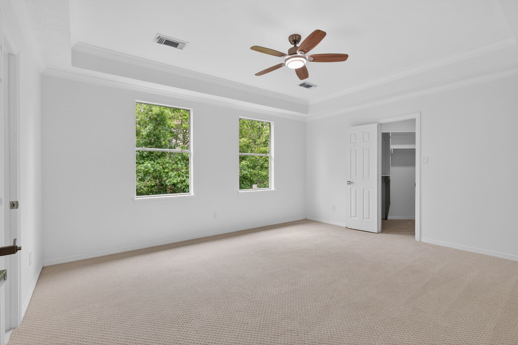 17519 Shelburne Lane Spring, TX 77379 - Photo 22 of 31 an empty room with windows and ceiling fan