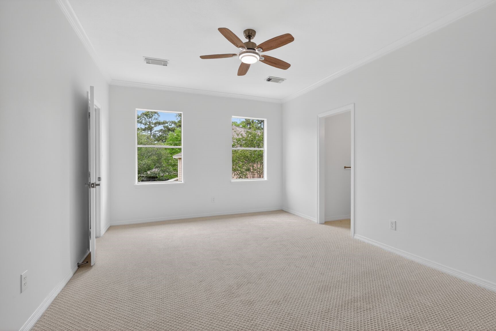 17519 Shelburne Lane Spring, TX 77379 - Photo 24 of 31 an empty room with windows and ceiling fan