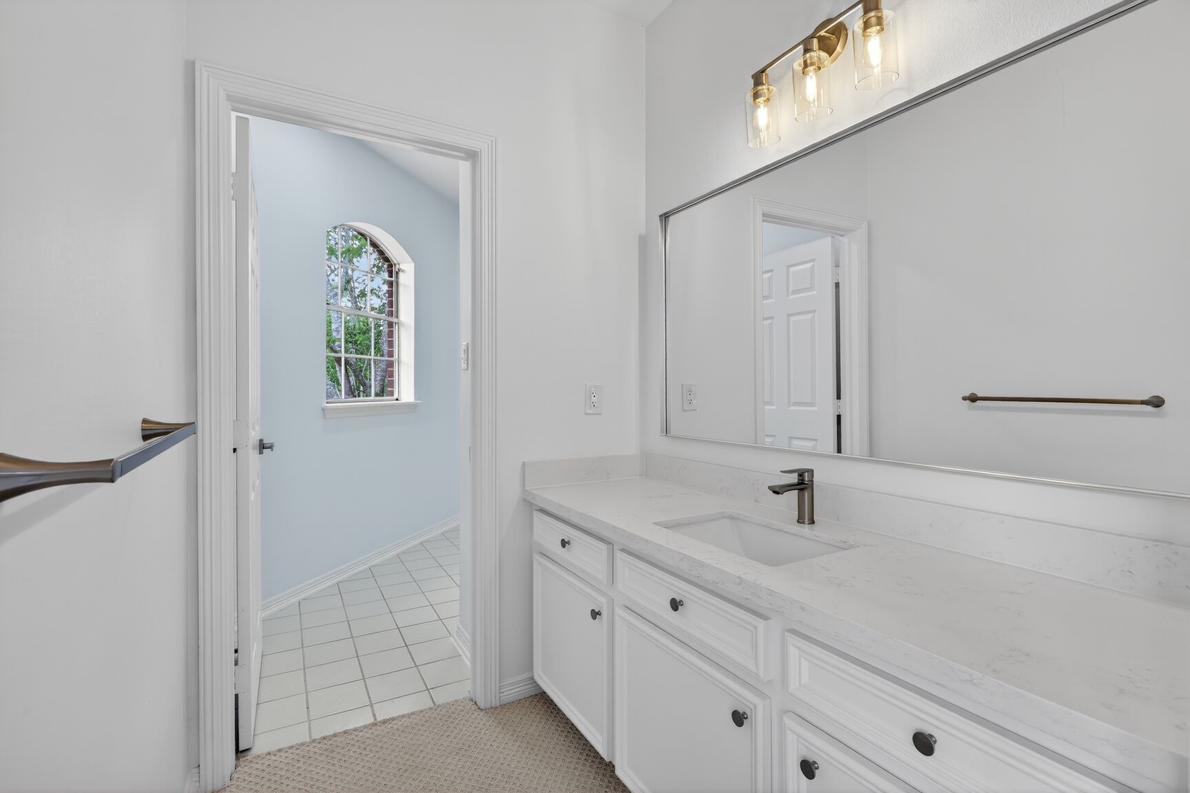 17519 Shelburne Lane Spring, TX 77379 - Photo 26 of 31 a bathroom with a sink and a mirror