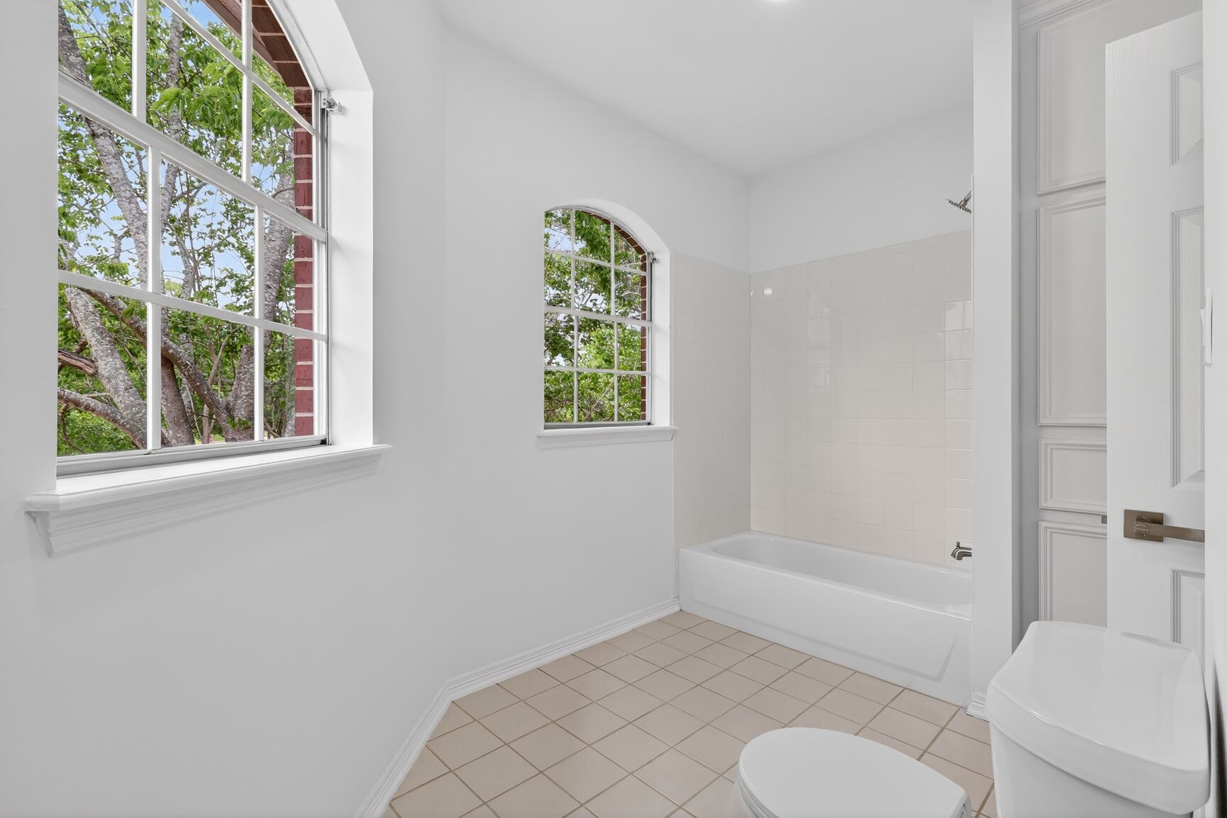 17519 Shelburne Lane Spring, TX 77379 - Photo 27 of 31 a bathroom with a toilet tub and shower