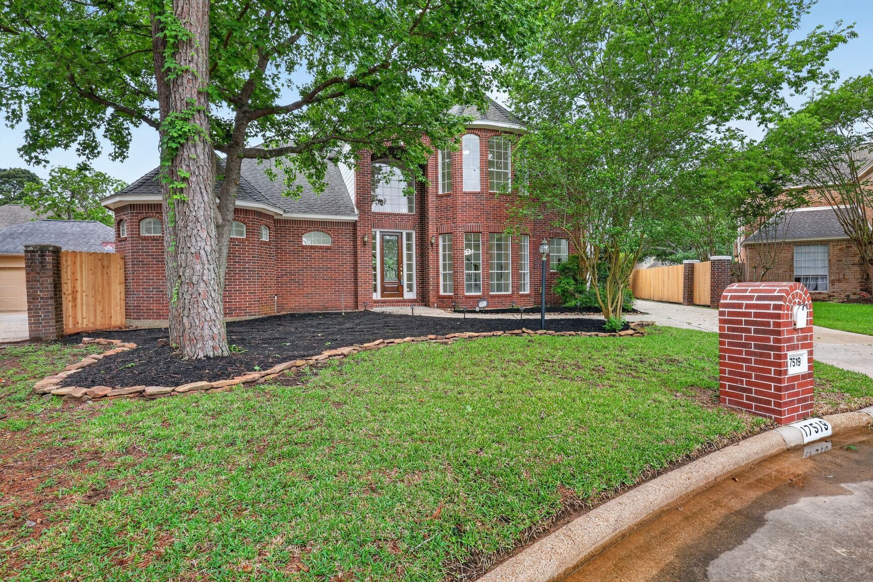 17519 Shelburne Lane Spring, TX 77379 - Photo 3 of 31 a front view of a house with a garden and yard