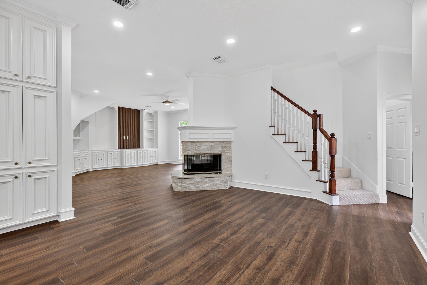 17519 Shelburne Lane Spring, TX 77379 - Photo 9 of 31 a view of a livingroom with wooden floor and staircase