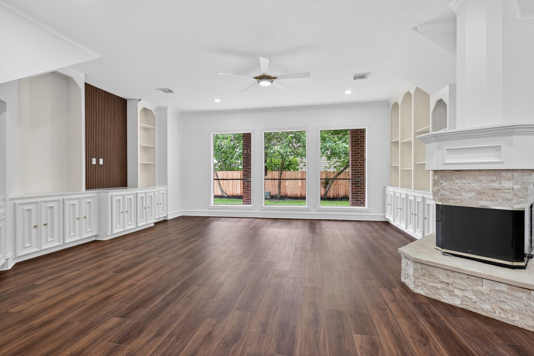17519 Shelburne Lane Spring, TX 77379 - Photo 10 of 31 a view of an empty room with wooden floor and a window