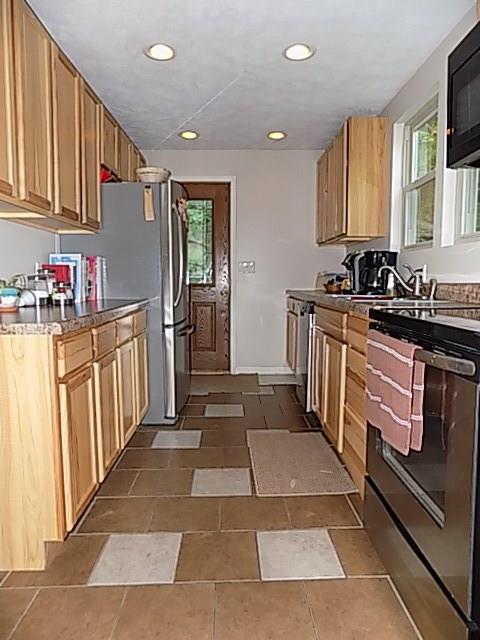 340 Thompson Run Road Pittsburgh, PA 15237 - Photo 3 of 23 Custom 13x8 Galley Style Kitchen has recessed lighting, Ceramic Tiled Flooring, and Stainless Steel!