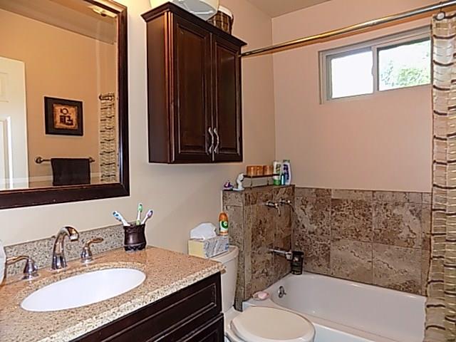 340 Thompson Run Road Pittsburgh, PA 15237 - Photo 8 of 23 Newly Remodeled Ceramic Tiled bathroom has been freshly painted with warm colors, granite vanity, and cherry cabinets for added storage.