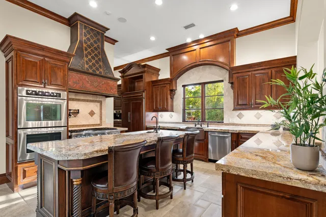 a kitchen with a table and chairs in it