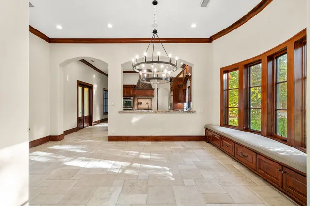 a view of entryway with a chandelier and living room