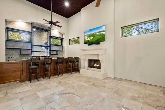 a view of a livingroom with furniture and a fireplace