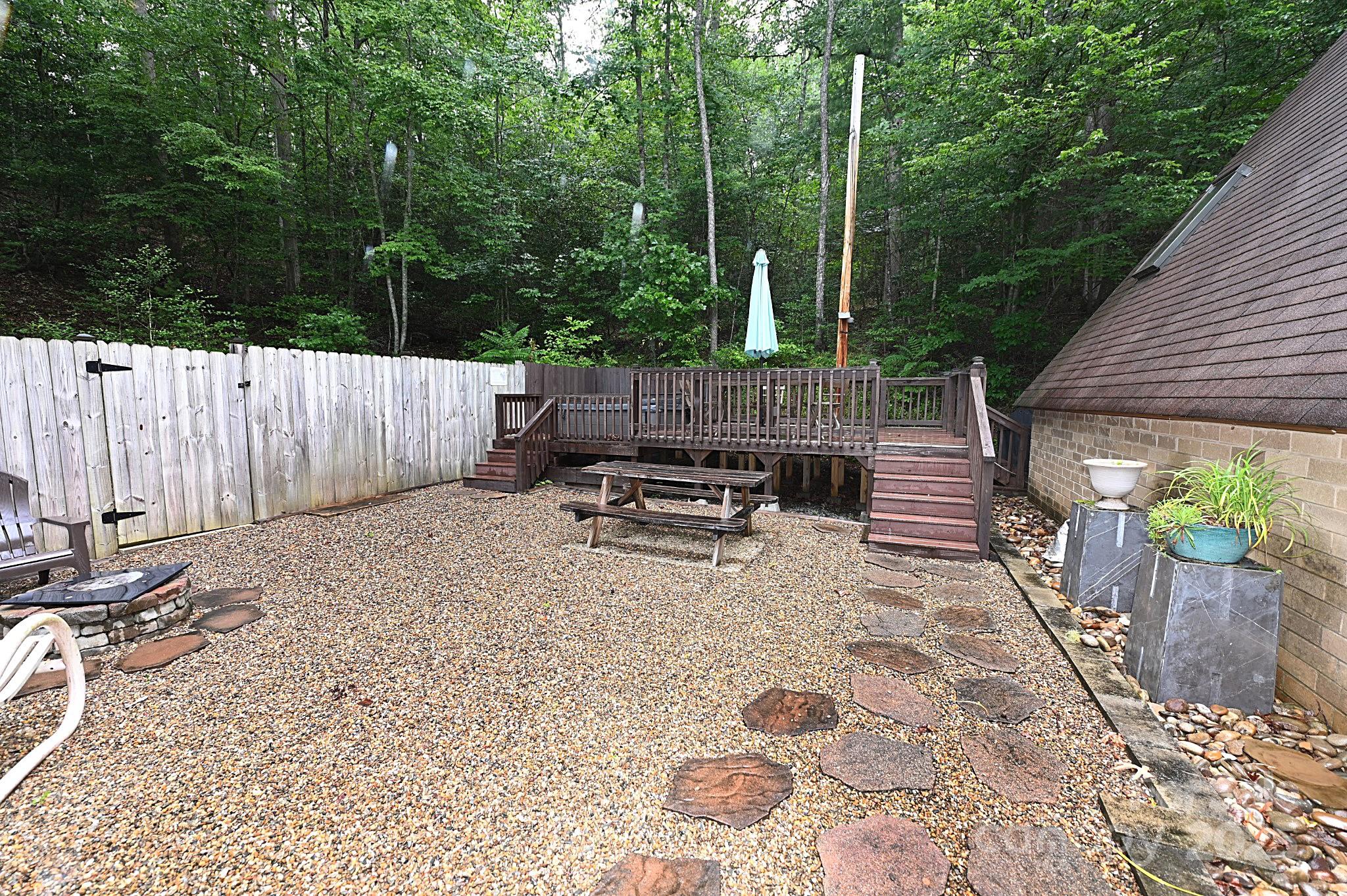 3430 Rose Creek Road Morganton, NC 28655 - Photo 22 of 48 a backyard of a house with barbeque oven