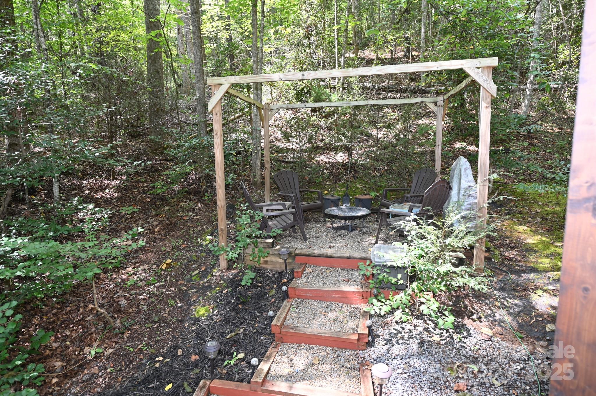 3430 Rose Creek Road Morganton, NC 28655 - Photo 27 of 48 a backyard of a house with lots of green space