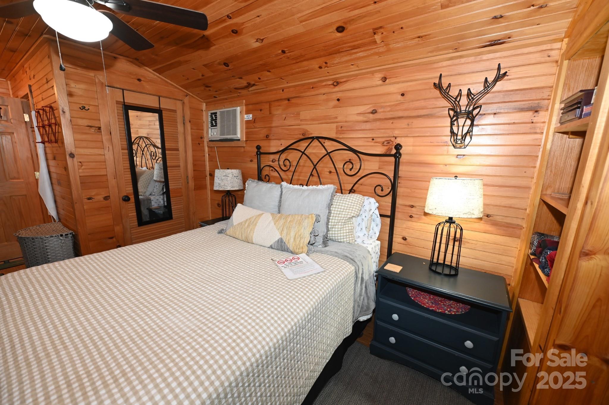 3430 Rose Creek Road Morganton, NC 28655 - Photo 32 of 48 a bedroom with a bed and wooden floor