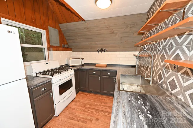 a kitchen with a stove and a microwave