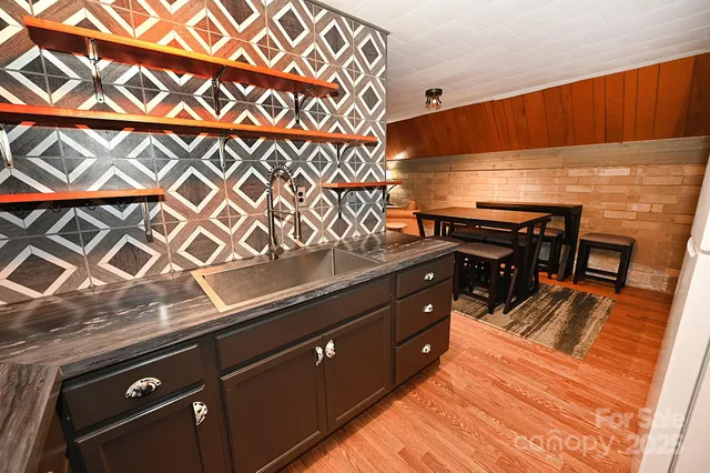 a kitchen with a sink and cabinets
