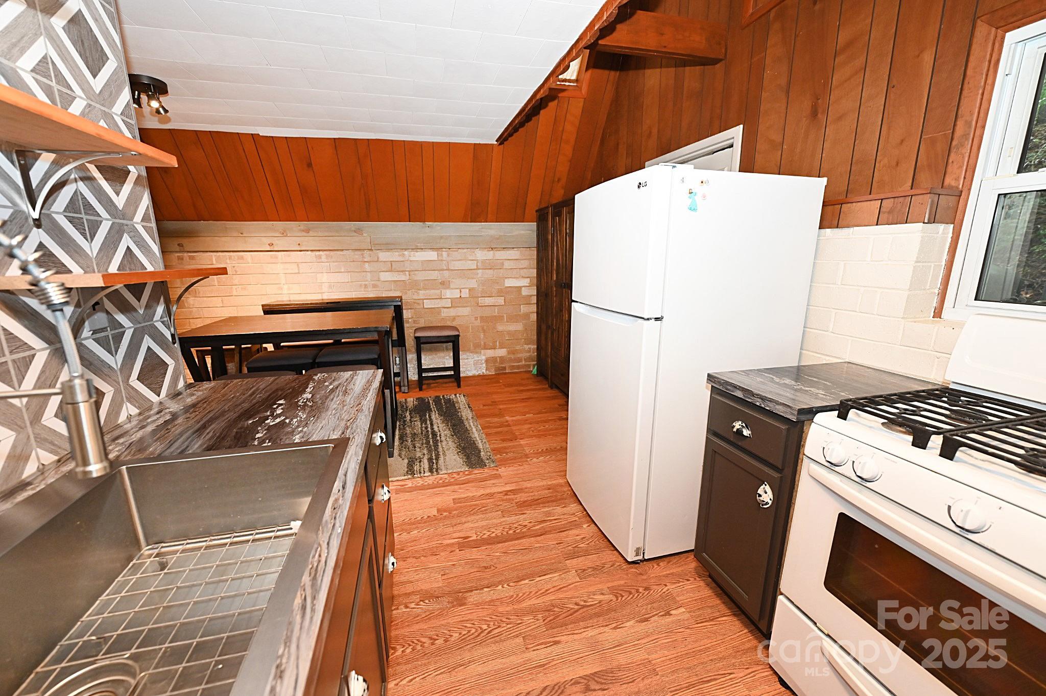 3430 Rose Creek Road Morganton, NC 28655 - Photo 9 of 48 a stove top oven sitting inside of a kitchen