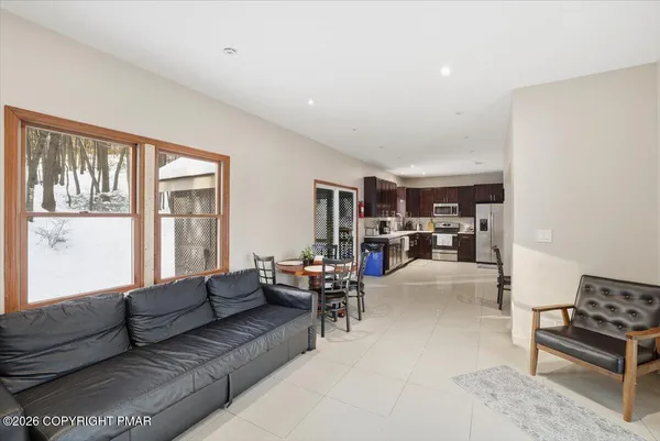 a kitchen with stainless steel appliances granite countertop a refrigerator stove top oven and sink