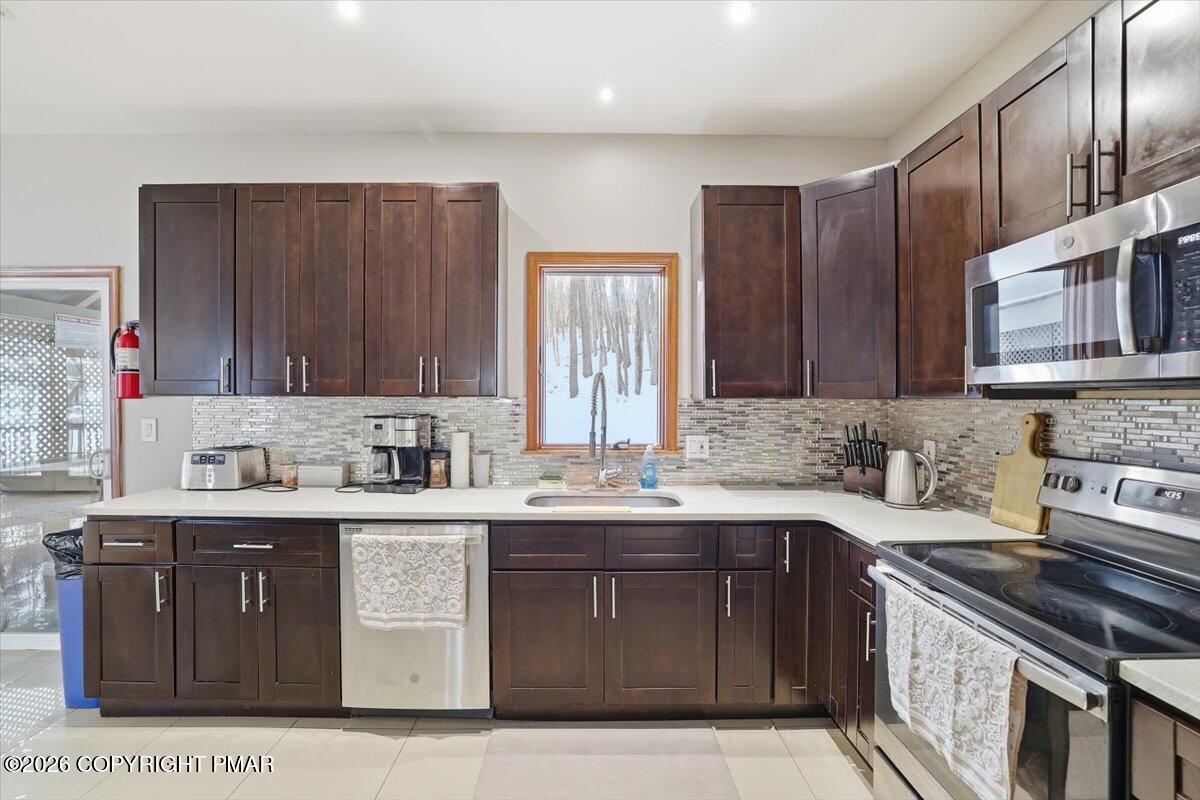 782 Lower Deer Valley Road Tannersville, PA 18372 - Photo 25 of 56 a kitchen with a sink stove top oven and cabinets