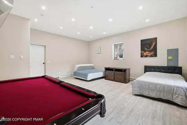 a bed sitting in a bedroom next to a window