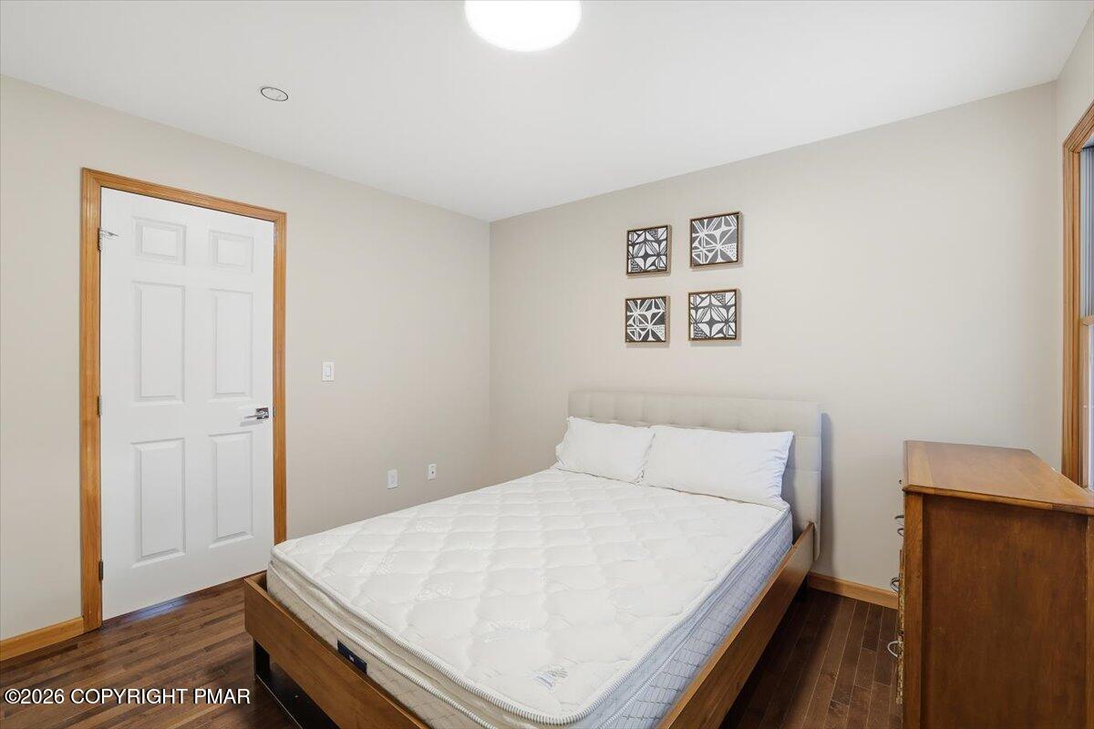 782 Lower Deer Valley Road Tannersville, PA 18372 - Photo 41 of 56 a bedroom with a bed and a wall painting